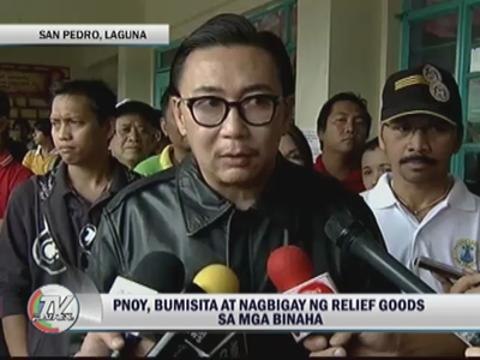 PNoy gives relief goods to Laguna flood victims