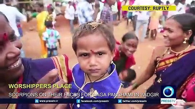 Worshippers place scorpions on their faces for Naga Panchami in Yadgir I ELISHA CHAUDHRY