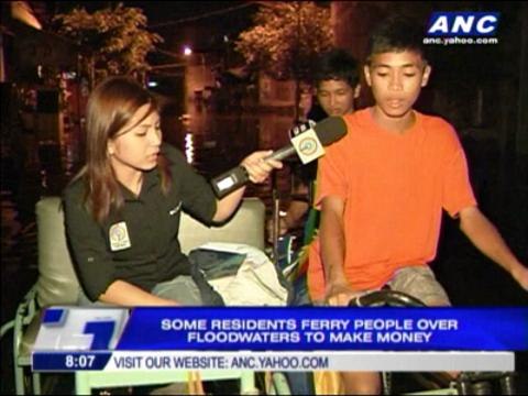 After floods, Malabon residents catch fish, eels