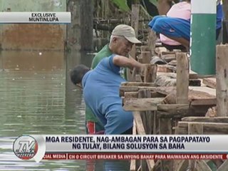 Flood-hit Muntinlupa residents pitch in to build bridge