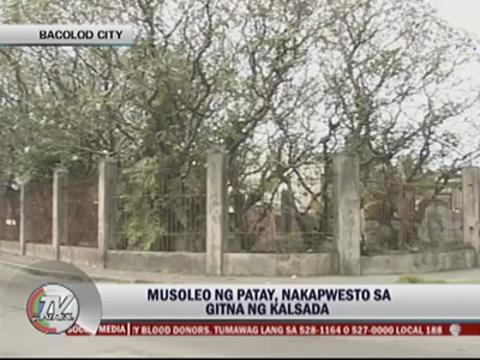 Tombs stand in middle of Bacolod street