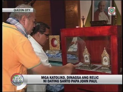 Catholics flock Blessed John Paul II's relics