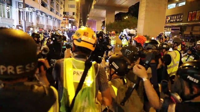Intense scenes as Hong Kong police forcefully remove journalists covering protests at station