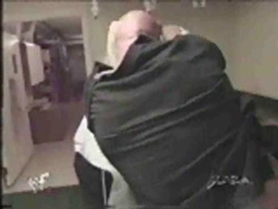 WWE  Kane attacks The Undertaker