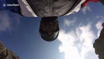 French daredevil wingsuits through narrow Italian mountain range