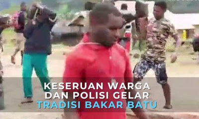 Keseruan Warga dan Polisi Menggelar Tradisi Bakar Batu