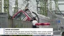 More than 30 injured as train, truck collide in Japan