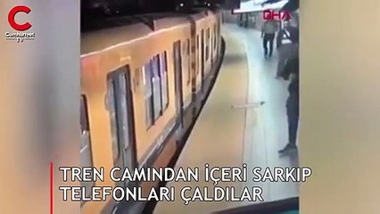 Tren camından içeri sarkıp telefonları çaldılar