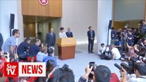 Hong Kong leader says China backs her 