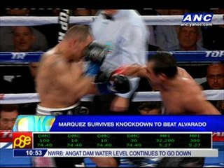 Marquez rallies to beat Alvarado