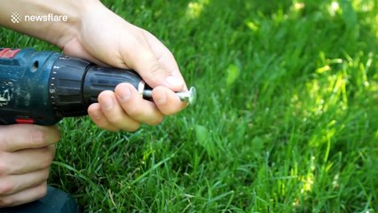 Vlogger shows off how to make a tiny axe out of a nail and a twig