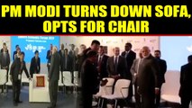 PM Modi opts for a chair instead of a sofa at Russia event, video goes viral | Oneindia News