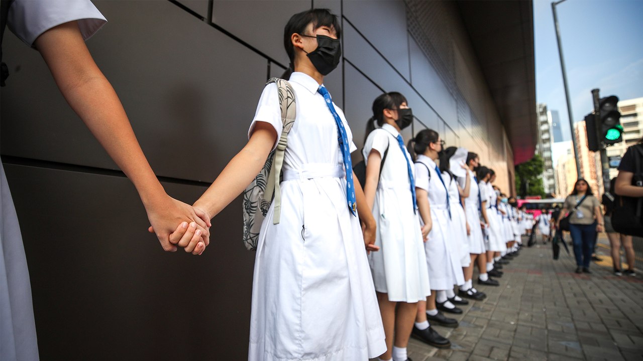 Hong Kong pupils and alumni from over 120 schools form human chains as anti-government protests continue