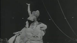 Marilyn Monroe riding a pink elephant (Original News 1955]
