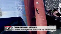 Rescuers pull out men trapped inside capsized cargo ship