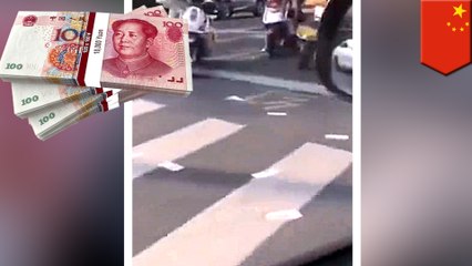 Thousands in Chinese moneyfound scattered all over the road