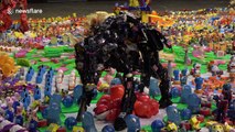 Artist makes dinosaur exhibition out of thousands of discarded plastic toys in Thailand