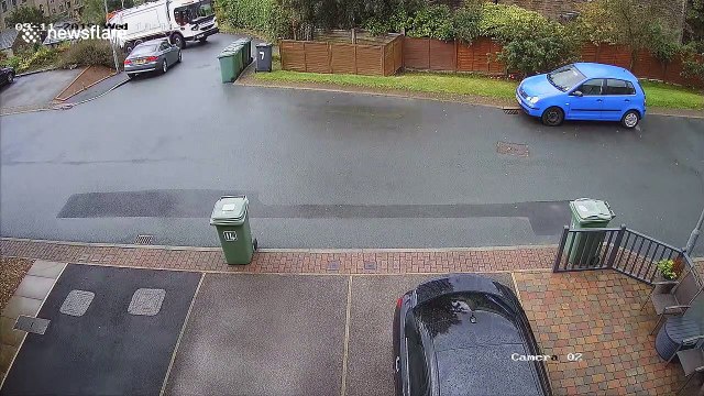 Rubbish driving: Garbage truck driver in northern England goes rogue, knocking over trash and swerving wildly on residential street