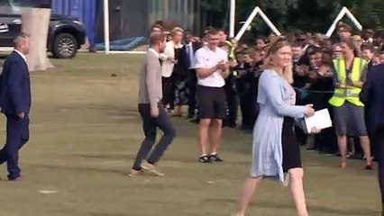 Prince Harry high fives school kids in Luton