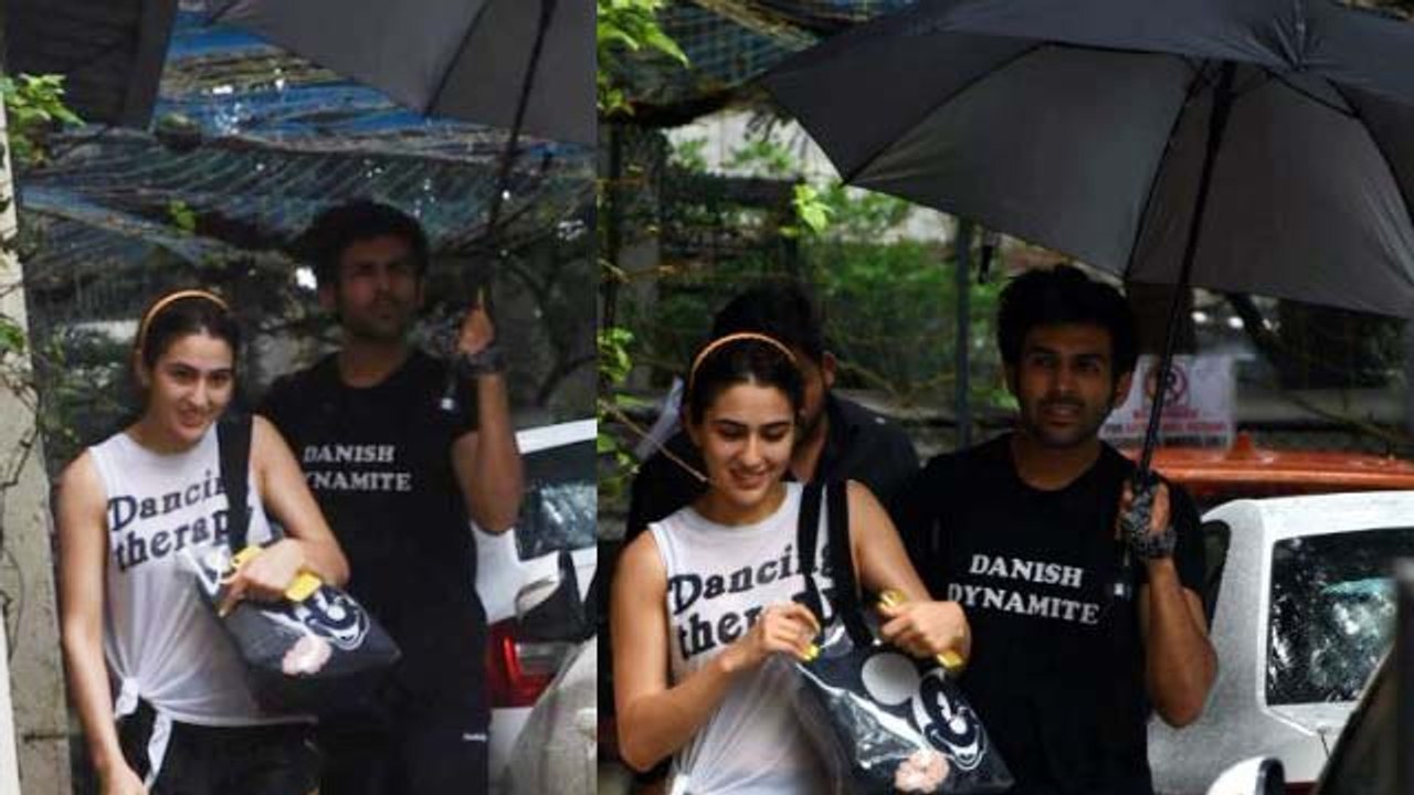 Sara Ali Khan को बारिश से बचाने छाता लेकर पहुंचे Kartik Aaryan | FilmiBeat
