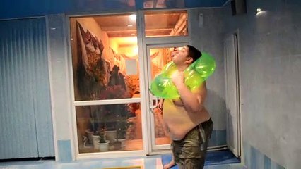 Dude Squeezes Through Pool Toy