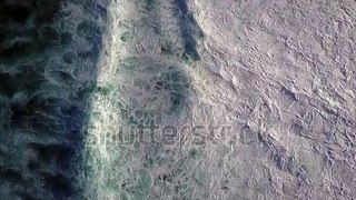 @　ノアパブリッシメント　stock-footage-big-waves-rolling-from-above-top-down-k-drone-view-on-blue-turquoise-ocean-breaking-waves