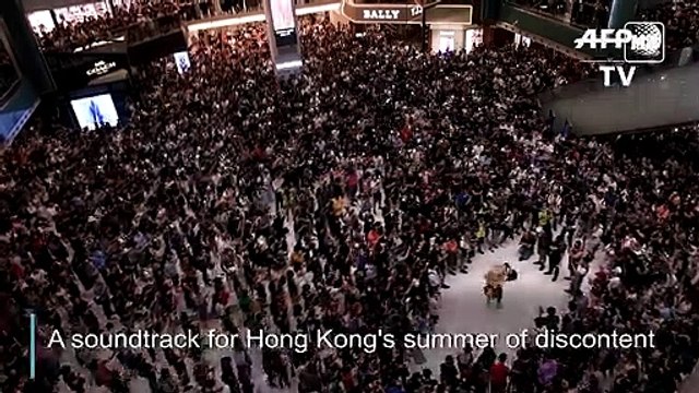 HK demonstrators rock new protest anthem
