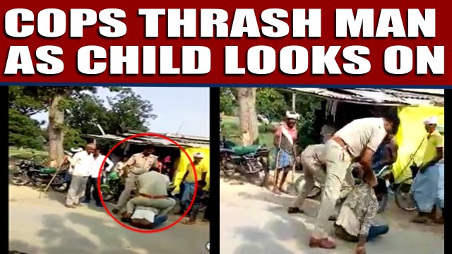 Cops thrash man for violating traffic rules as child looks on | Oneindia News