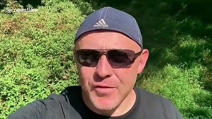 US scuba diver retrieves woman's phone after she dropped it into a river