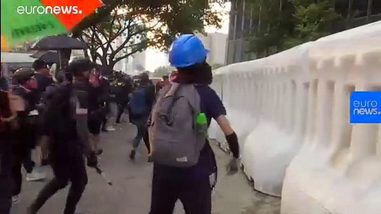 Hong Kong: Protesters sing God Save the Queen as they face off with riot police