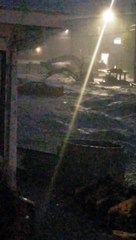 Floodwaters Wreak Havoc on Suburban Street