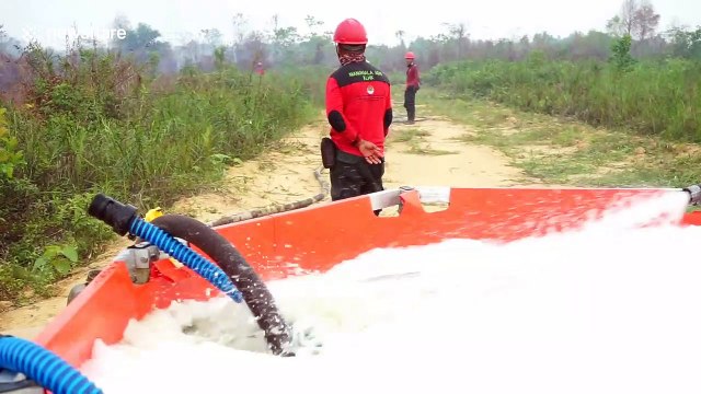 Fire task force in Indonesia extinguishes burning peatlands to combat haze crisis