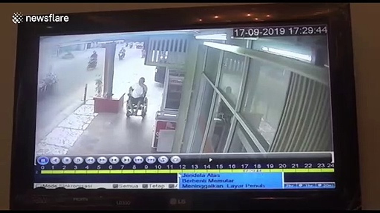 CCTV footage shows thief snatching phone from disabled man's hands in Indonesia