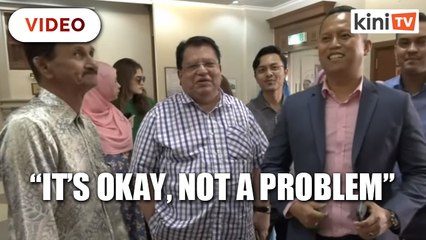 Not a problem, says Ku Nan when surrounded by cameras