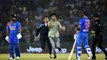 Pitch invader tries to shake hands with Virat Kohli, taken off field