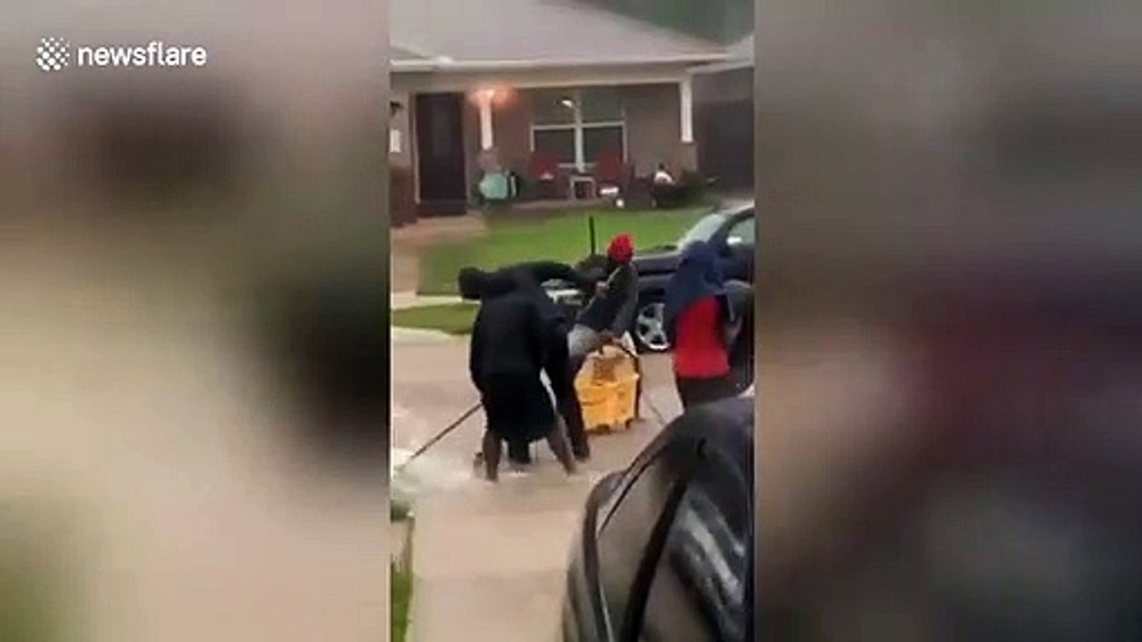 Houston kids are NOT having it with flooded roads as they 'clean up
