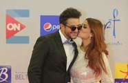 قبلات أحمد الفيشاوي وزوجته على السجادة الحمراء في مهرجان الجونة