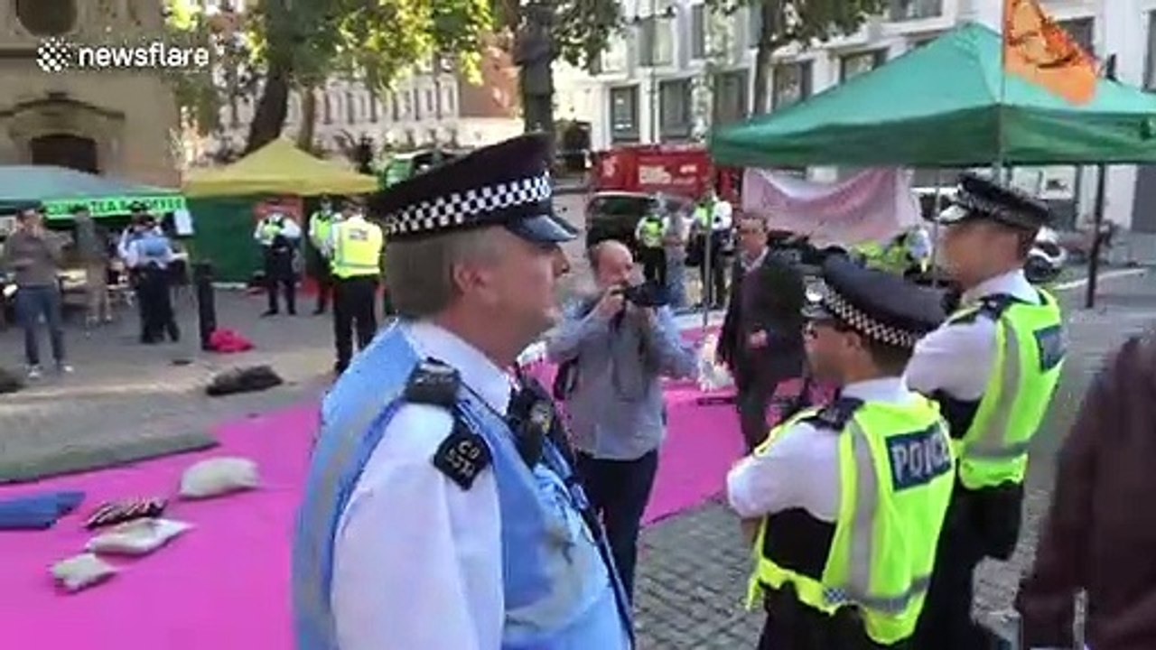 Police in London arrest Extinction Rebellion protesters reciting prayers