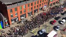 Thousands of climate change activists seen lining the streets of Manchester