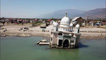 Drone images show damage one year after Indonesia earthquake, tsunami