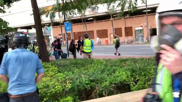 Hong Kong protesters take position behind wall of umbrellas ahead of confrontation with police
