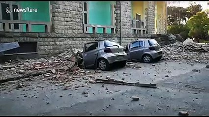 Download Video: Destroyed cars lie next to damaged building after earthquake hits Tirana, Albania