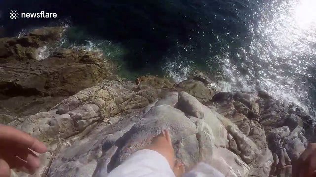 Man narrowly avoids injury after jumping into sea from high cliff in France
