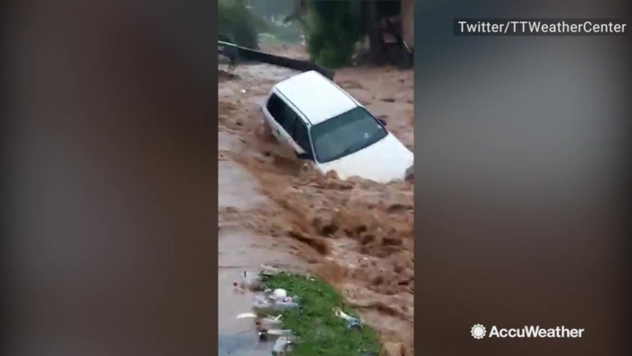 Car swept away by flood waters