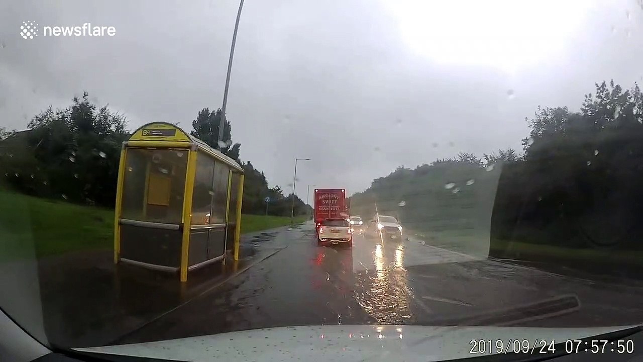 Flash flood leaves UK road deluged