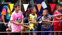 Bizarre race in Thailand where boys make a human boat and run through muddy field