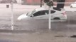 Moving Car Floats and Slides Sideways on Flooded Street