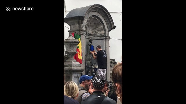 Famed Belgian peeing statue gets 'dressed up' for autumn
