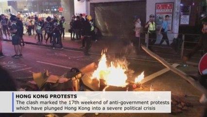 Teargas, water cannons and fires at unauthorized mass rally in Hong Kong