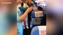 Chinese woman causes delay on flight by opening emergency exit for 'fresh air'